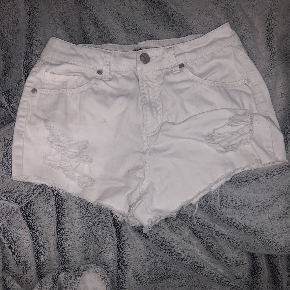 white ripped shorts